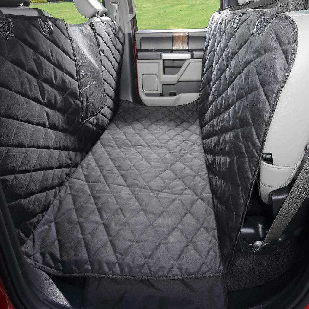Black Floor Hammock covering the floor between the front seats and the folded-up rear seats of a crew cab