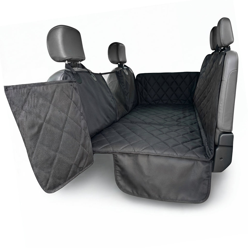 Black quilted 4Knines hard bottom extender installed, with door panels and headrest straps