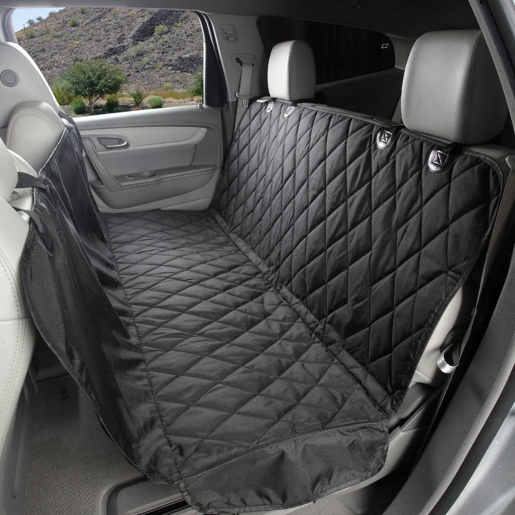Black quilted 4Knines seat cover set up as a hammock across the back seat of an SUV