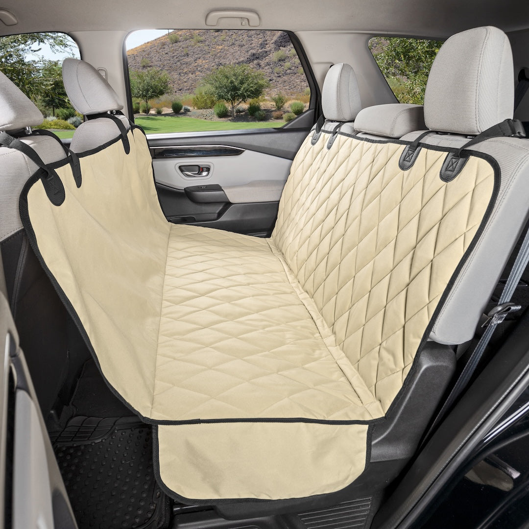 Tan quilted 4Knines seat cover in hammock mode in an SUV's back seat