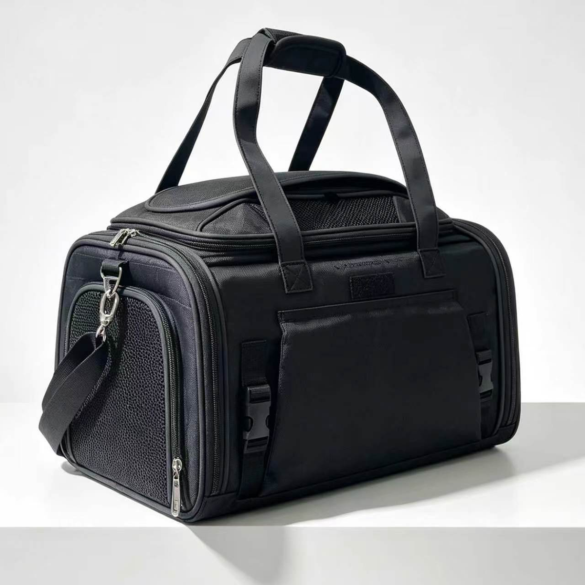 Black Gold Series Mini carrier closed, with the carry handles up and the side buckles fastened