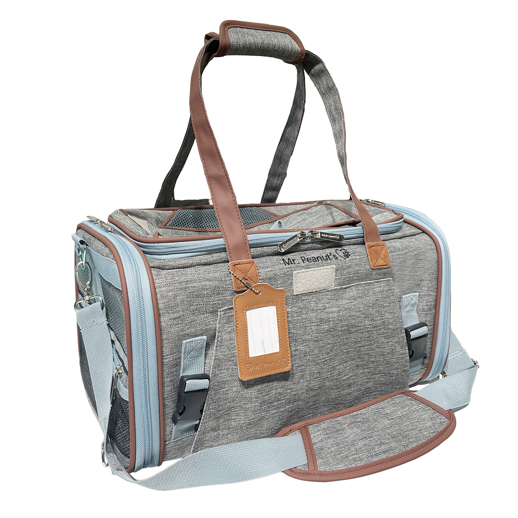 Gray Gold Series Mini carrier with brown handles, a luggage tag and the padded shoulder strap attached