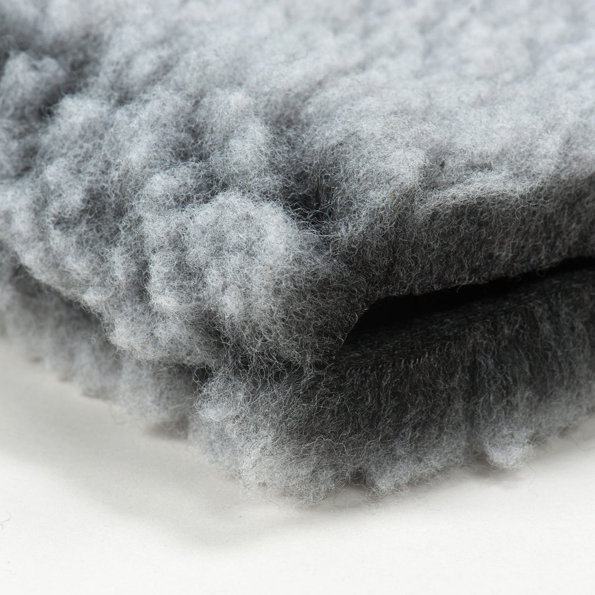 Close-up of the thick gray fleece texture