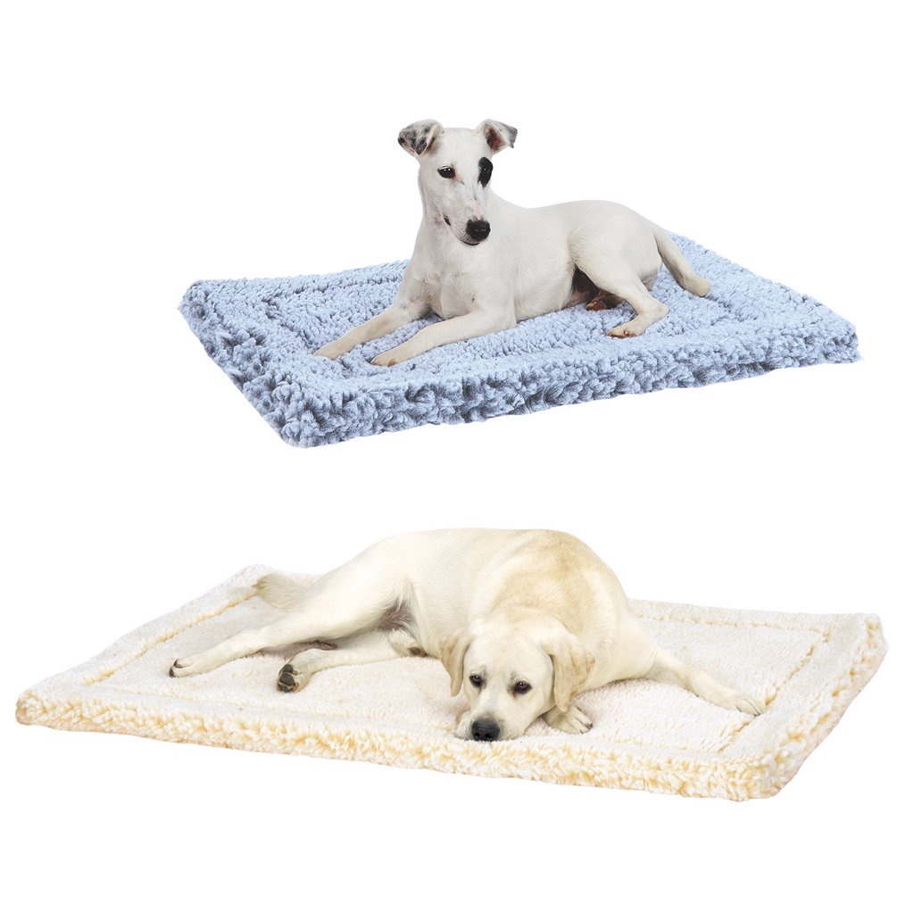 White dogs lying on a blue fleece mat and a cream fleece mat