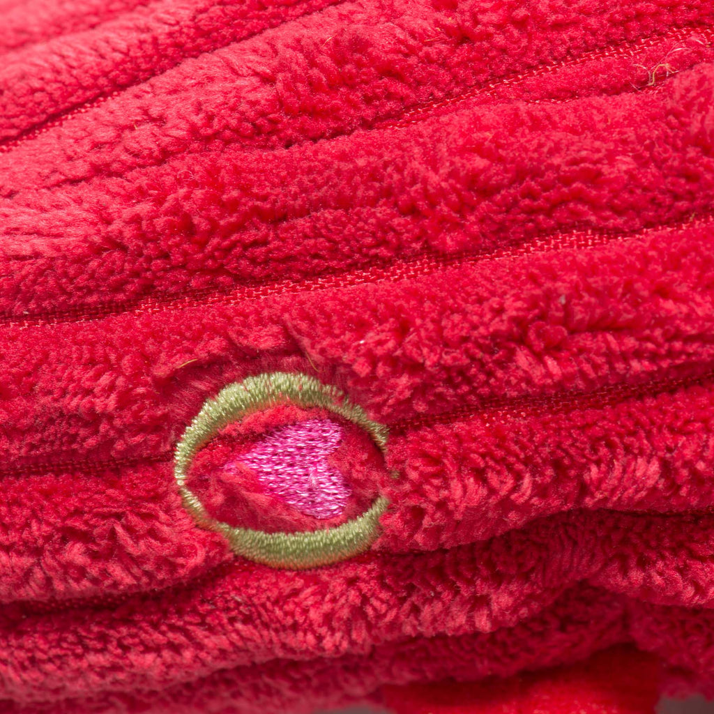 Close-up of the embroidered heart patch on the red lobster toy