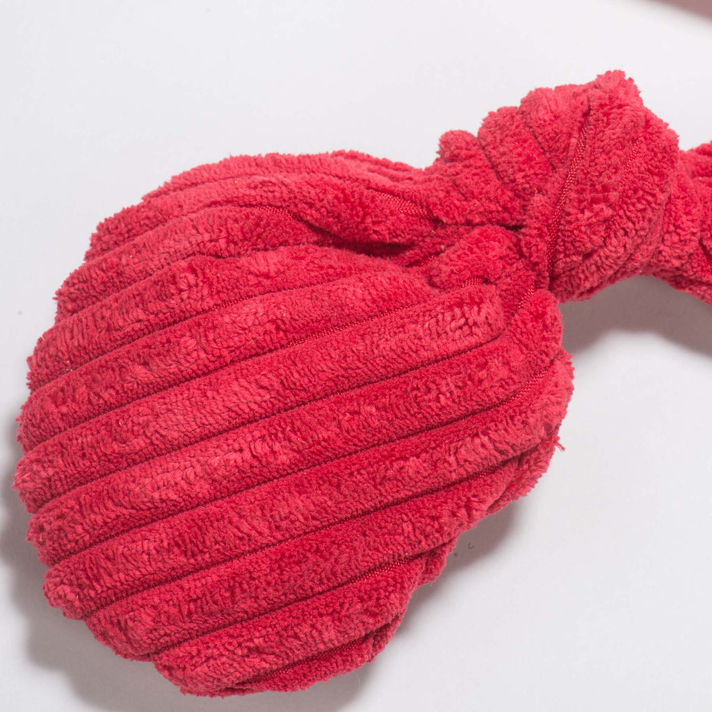 Close-up of a red corduroy claw on the lobster plush toy