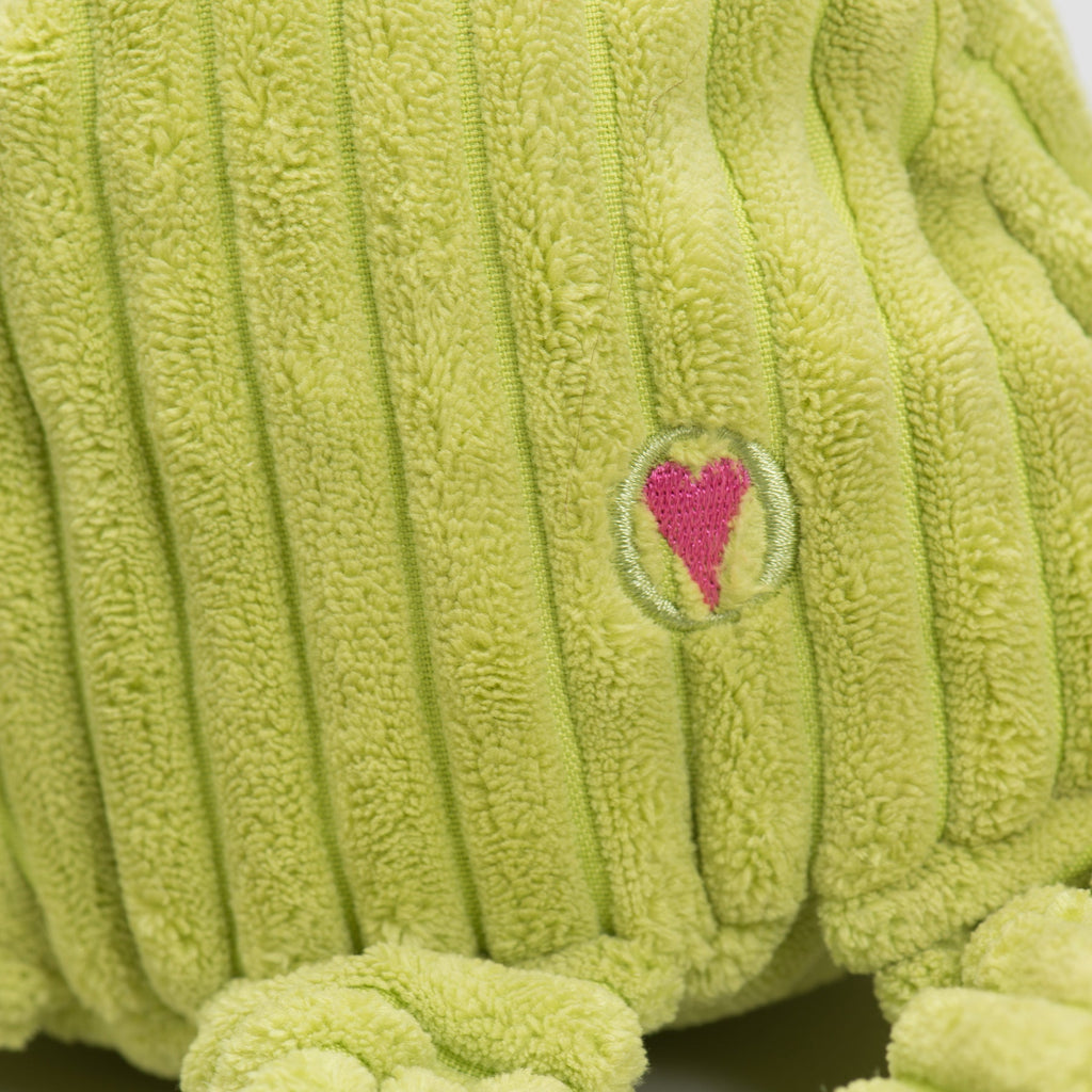Close-up of the green corduroy with a small embroidered pink heart logo