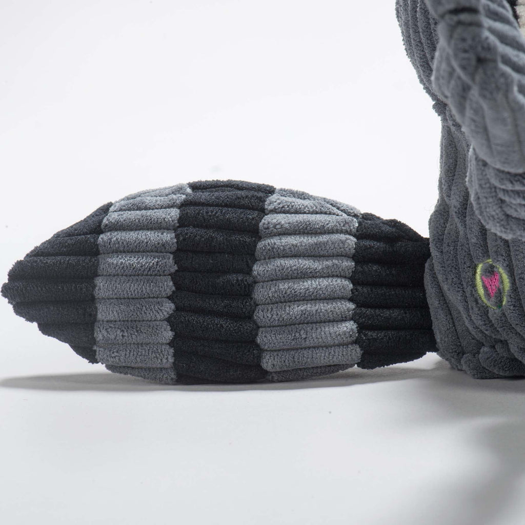 Close-up of the raccoon toy's black and gray striped corduroy tail