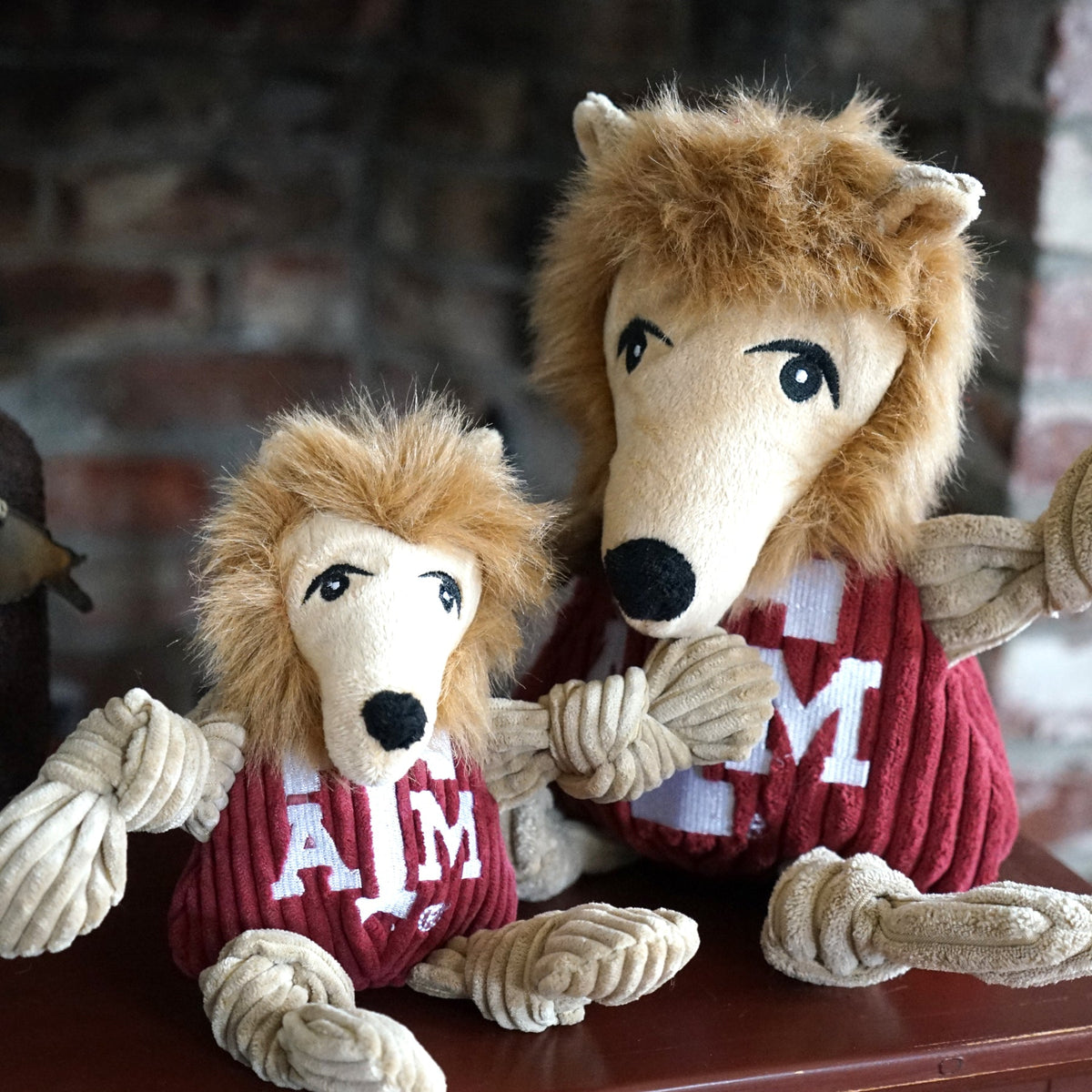 Small and large Reveille Knottie toys side by side on a table