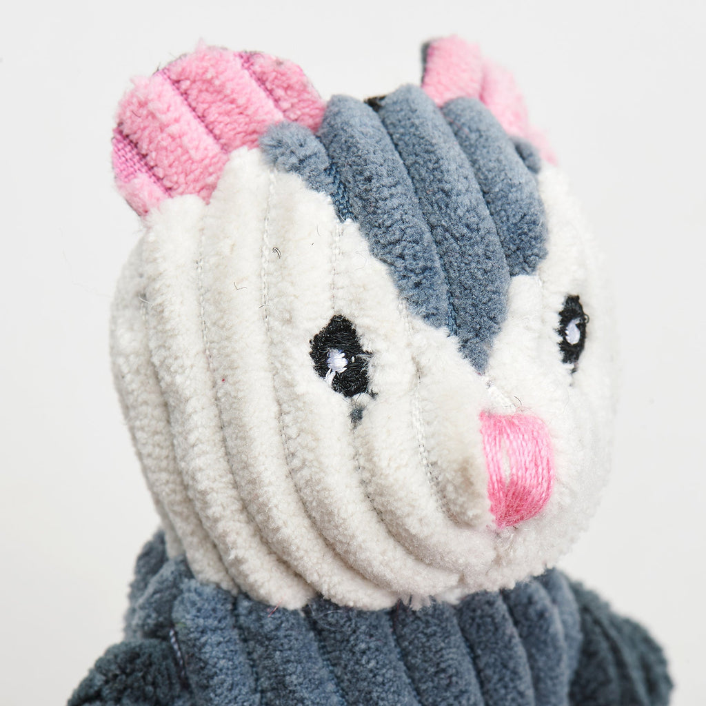 Close-up of the opossum toy's pink embroidered nose