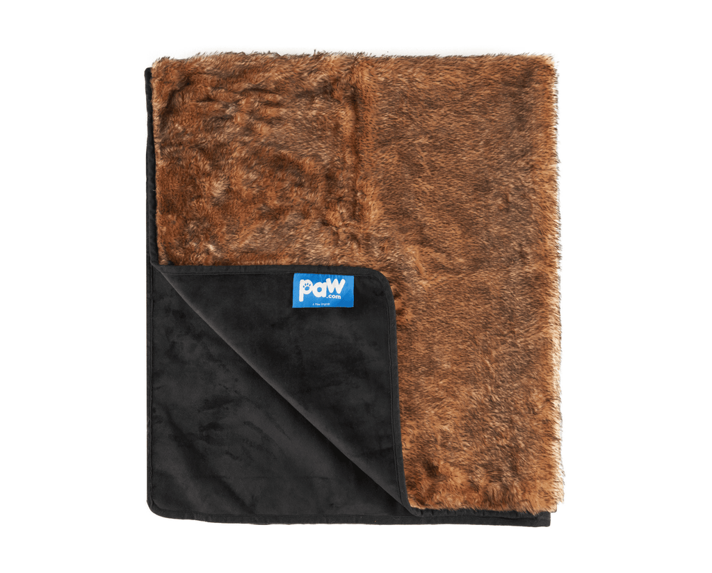 Folded sable tan throw turned back to show its dark microsuede reverse side