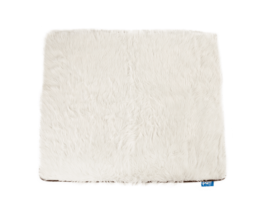 Polar white long-pile faux fur throw laid flat on a white background