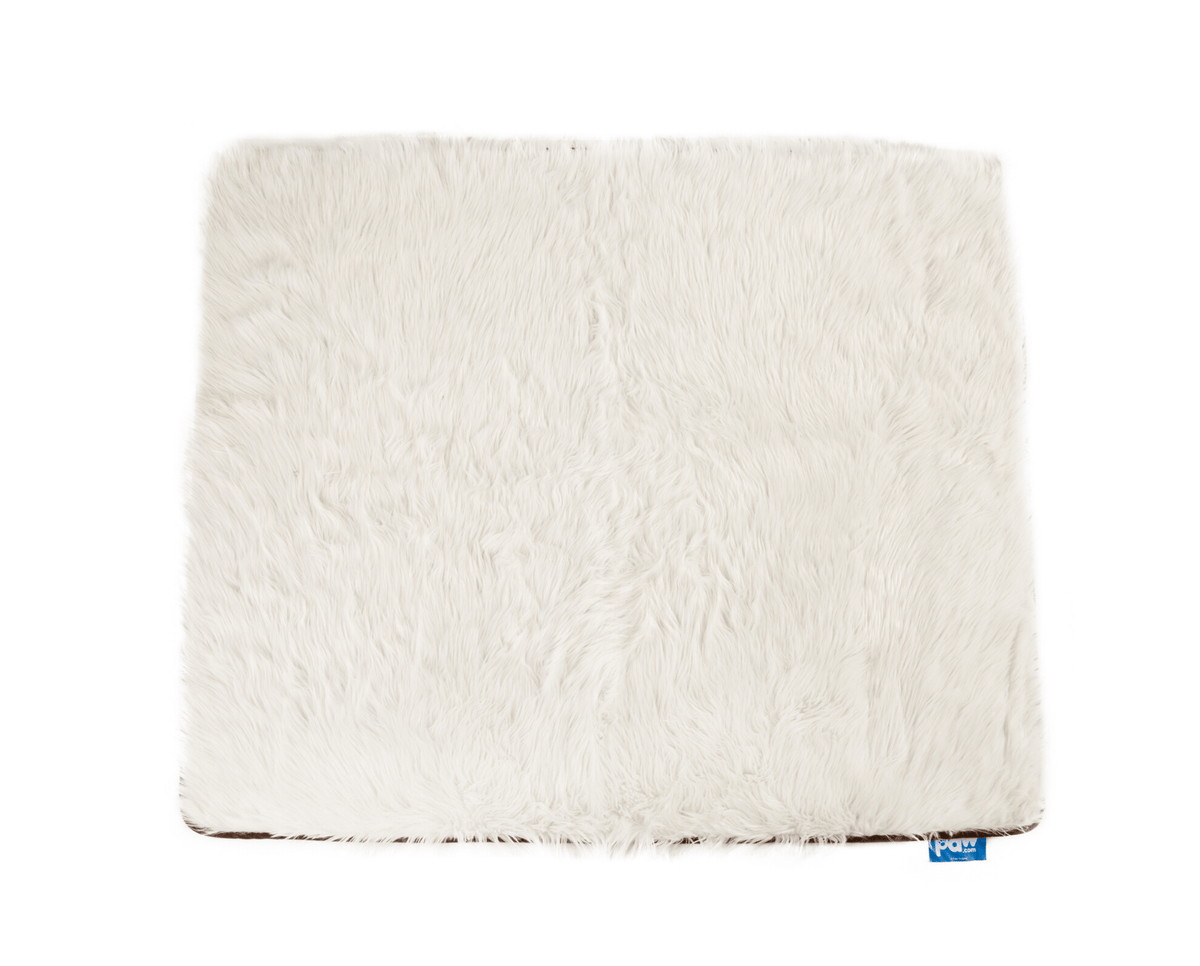 Polar white long-pile faux fur throw laid flat on a white background