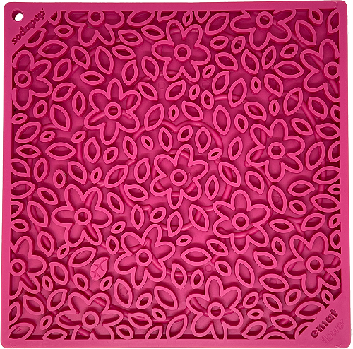 Pink rubber lick mat with a raised flower pattern