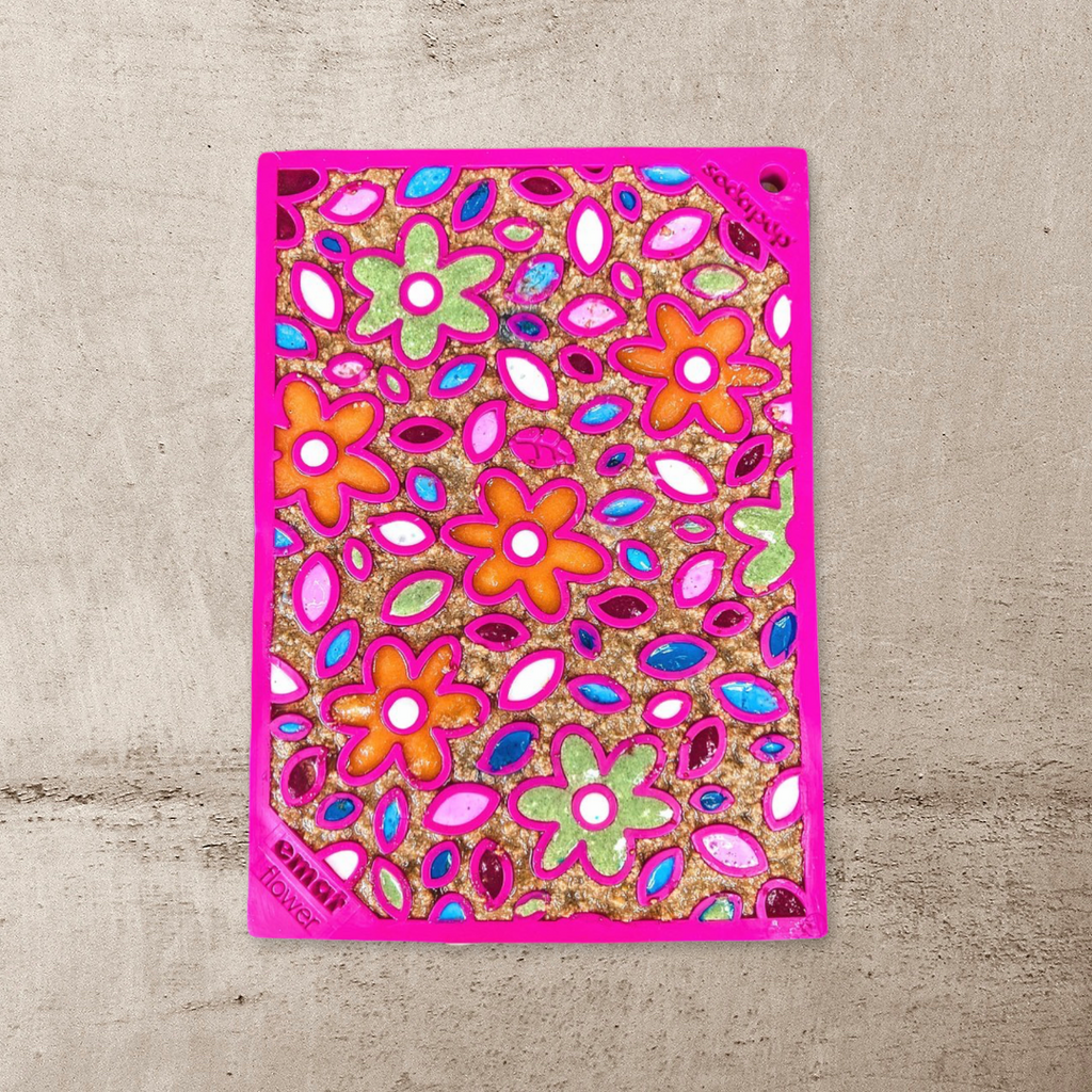 Pink flower lick mat spread with colorful treats