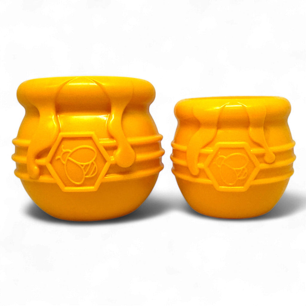 Two orange honey pot treat toys in two sizes