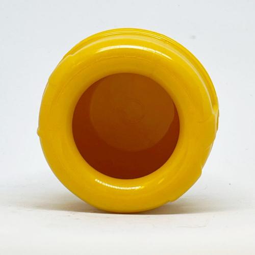 Yellow honey pot toy turned on its side to show the open top