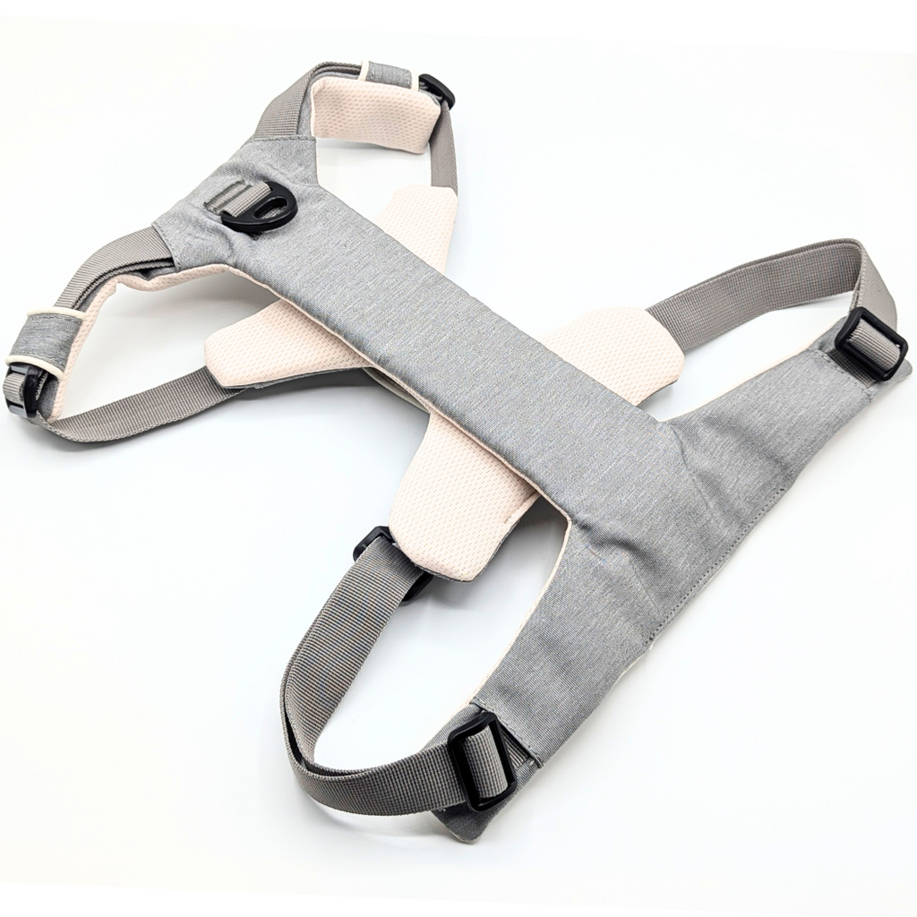 Gray and cream dog harness laid flat, back view