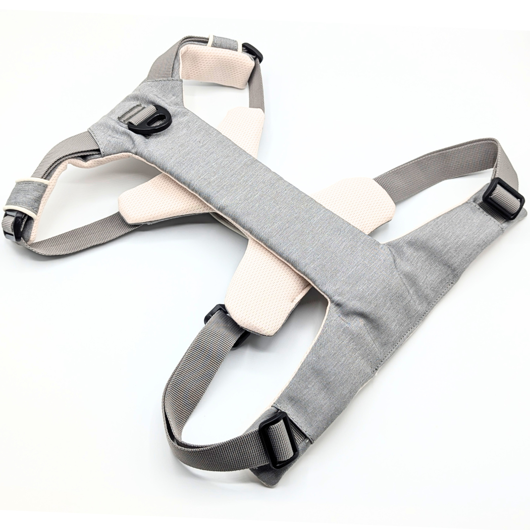 Gray and cream dog harness laid flat, back view