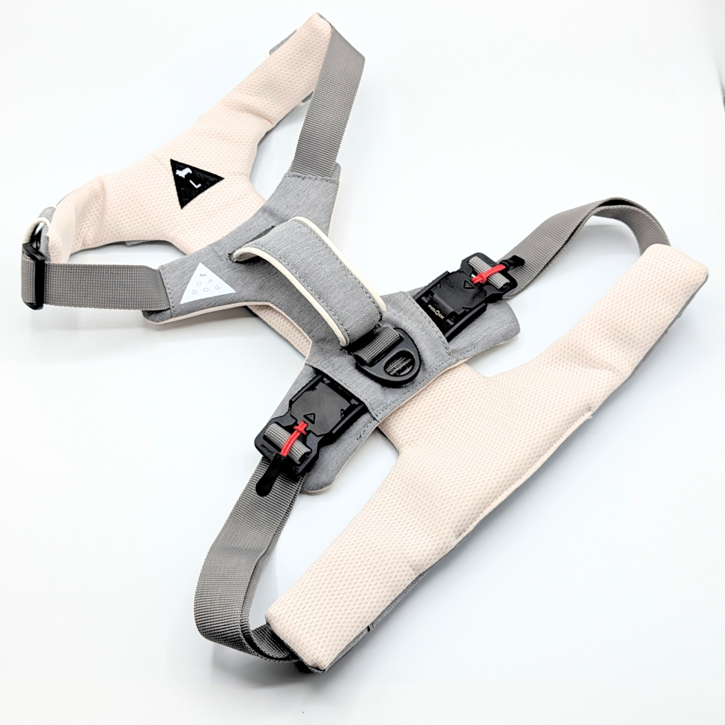 Gray and cream dog harness with red-tab magnetic buckles