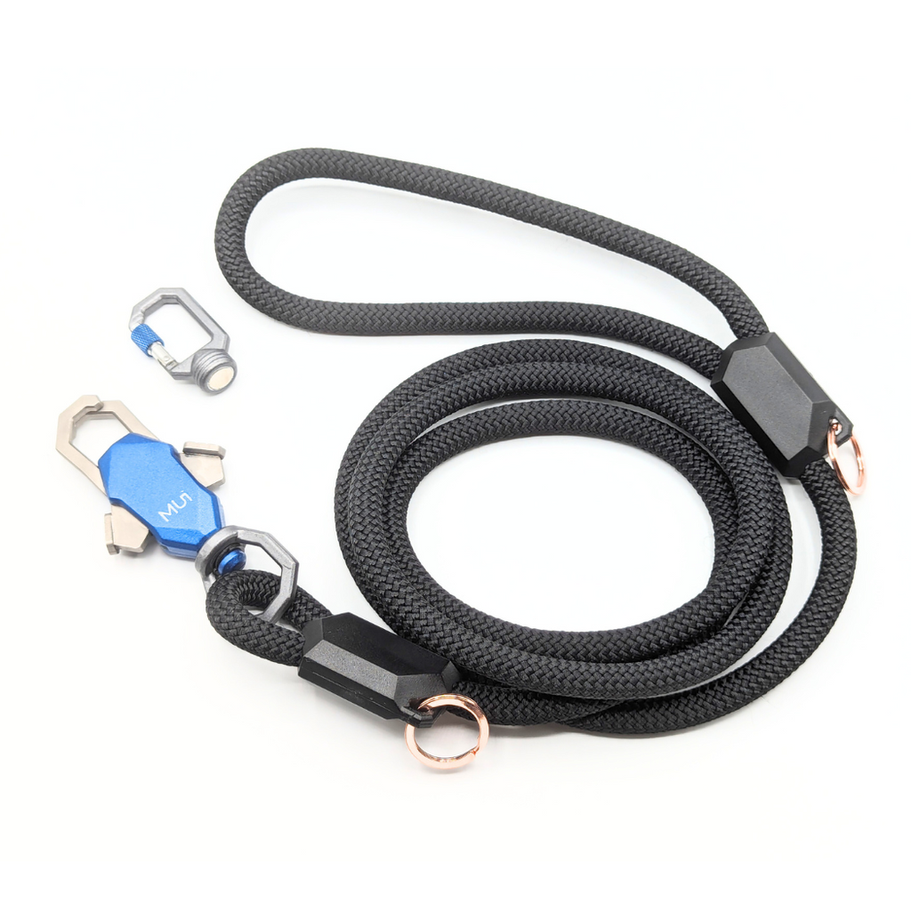 Black rope leash coiled with its magnetic latch and clip