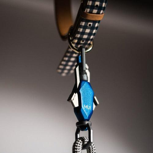 Blue magnetic latch connected to a collar's metal ring