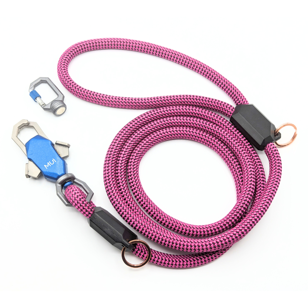 Pink rope leash coiled with its magnetic latch and clip
