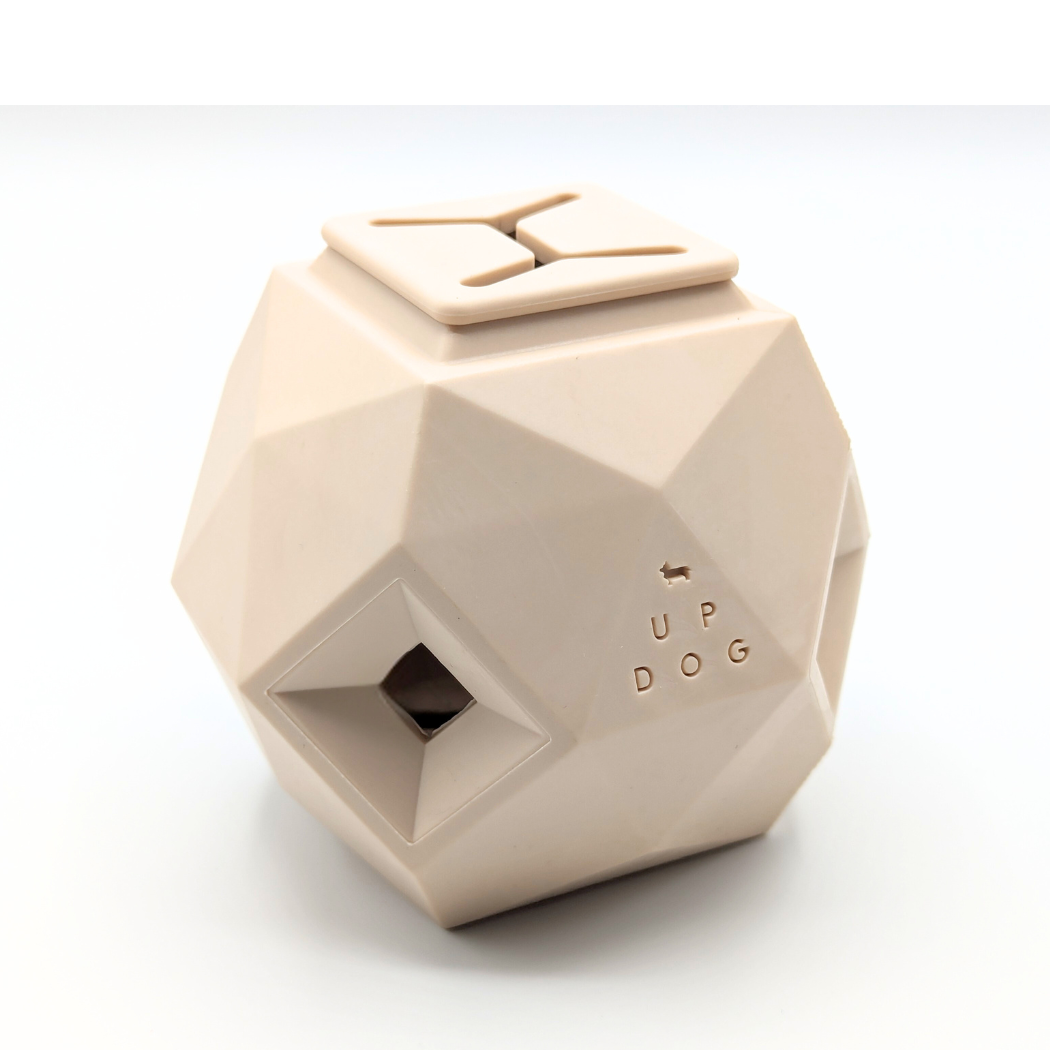 Sand-colored geometric treat dispensing dog toy