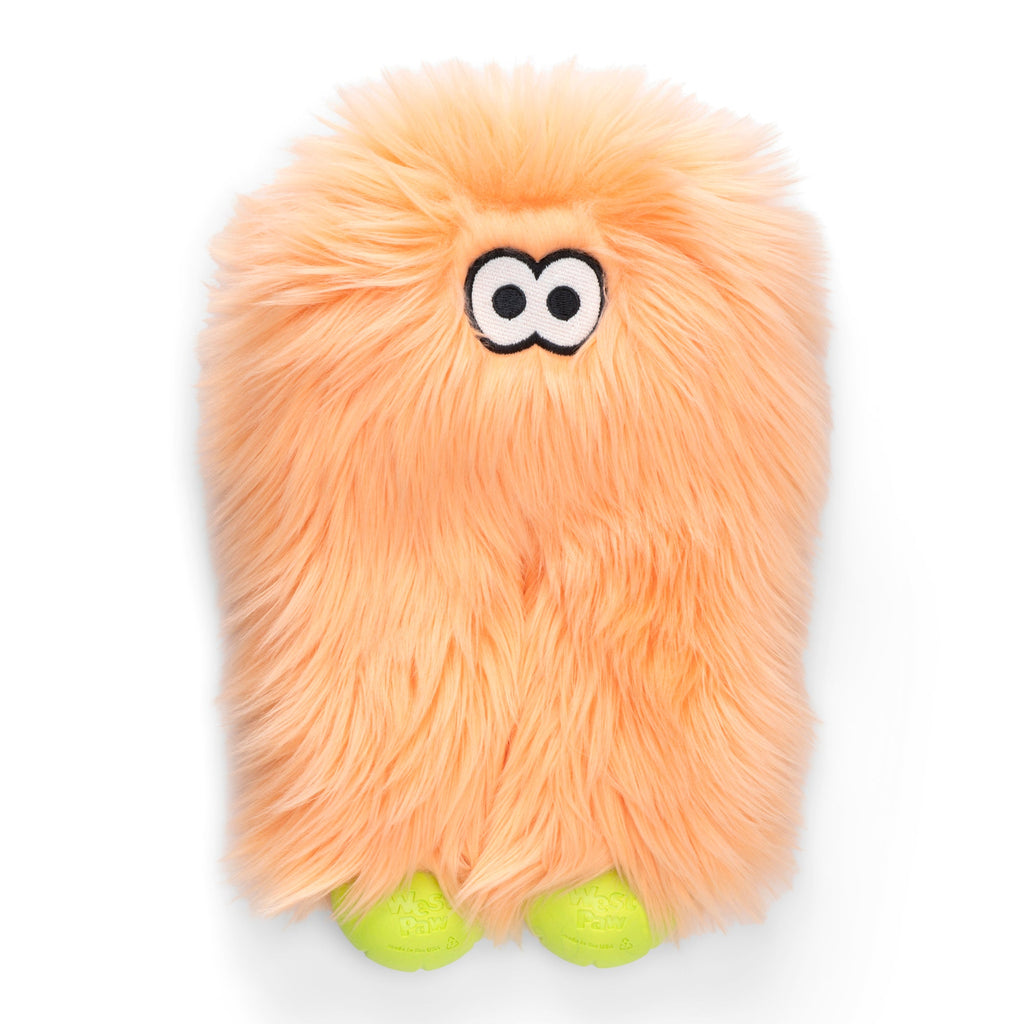 Peach shaggy plush dog toy with googly eyes and green ball feet