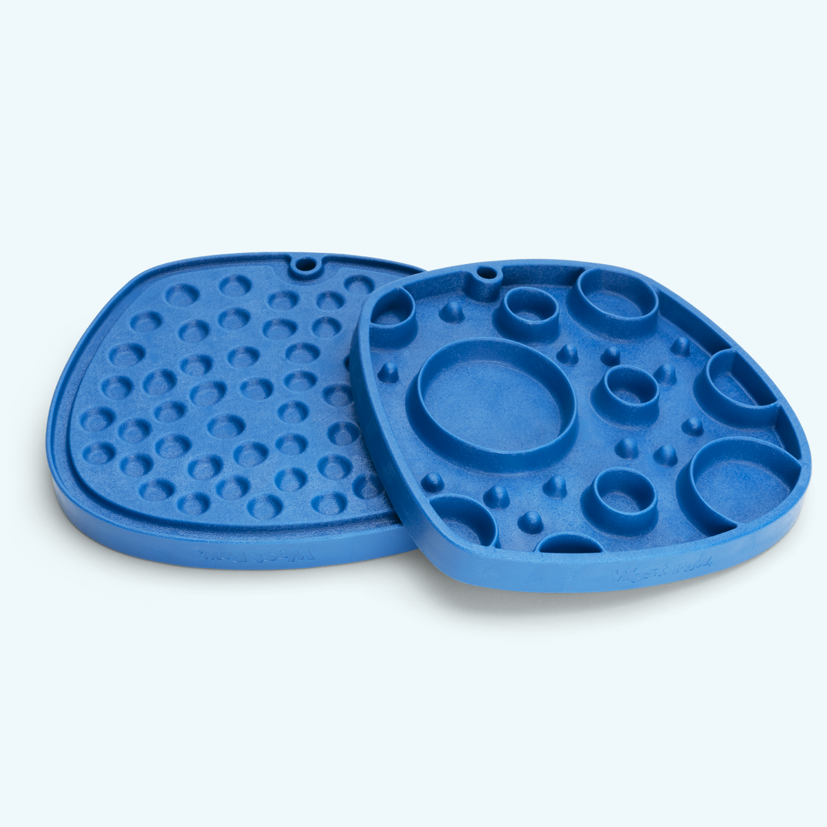 Two blue feeding mats with round wells and raised dots