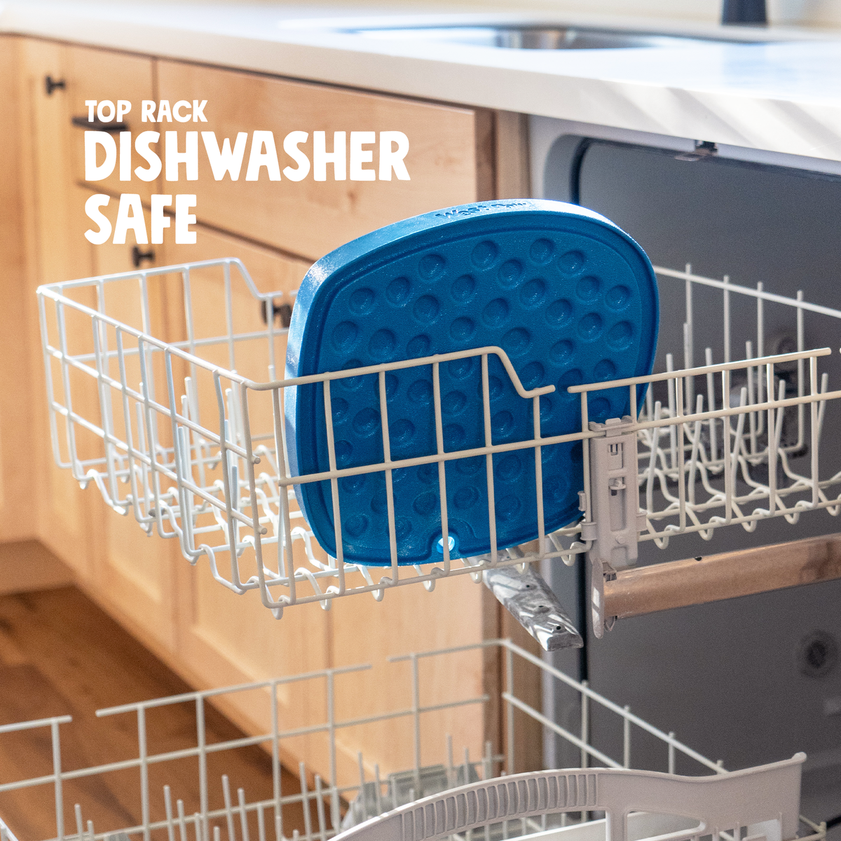 Blue feeding mat standing in the top rack of a dishwasher