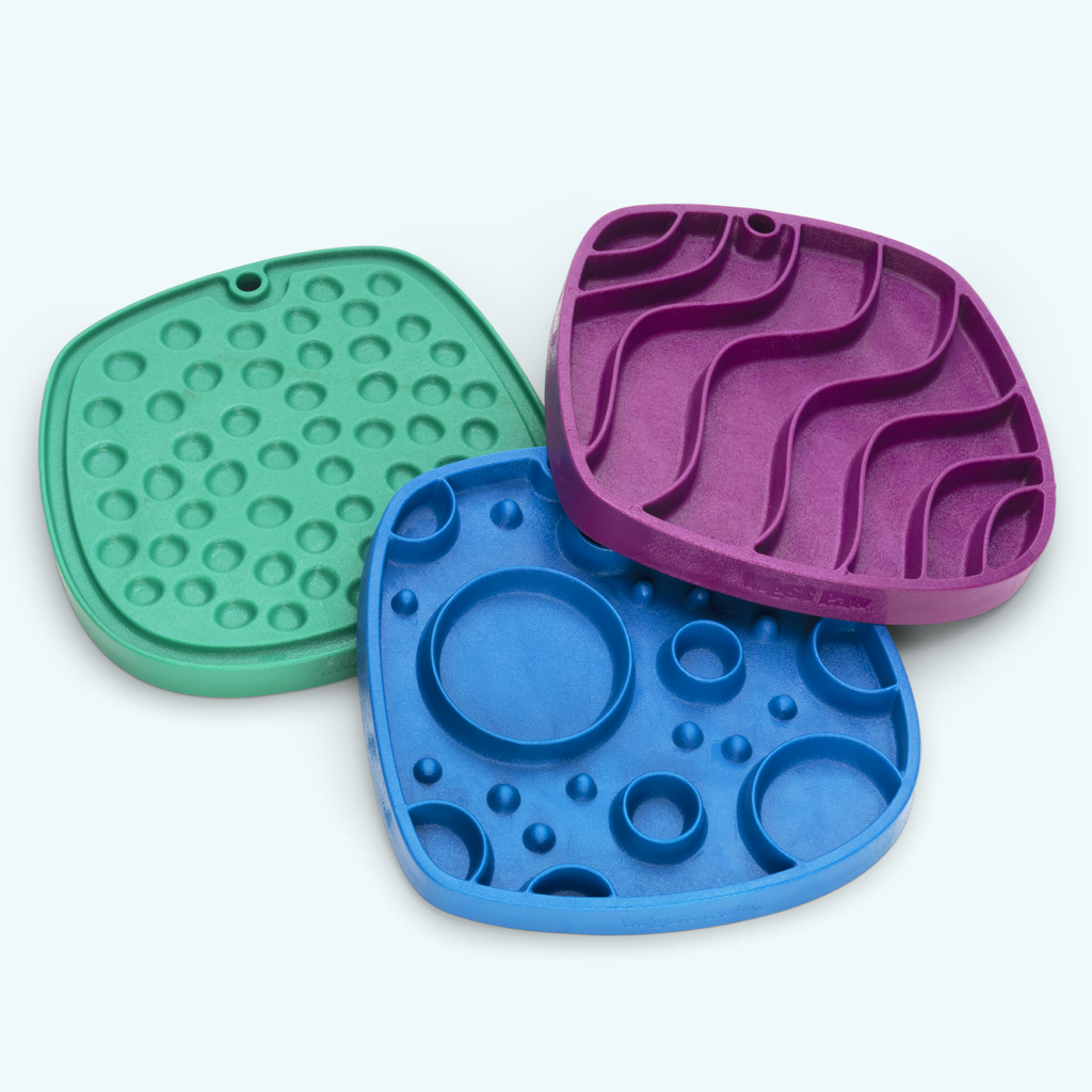 Feeding mats in green, blue and purple with different raised patterns