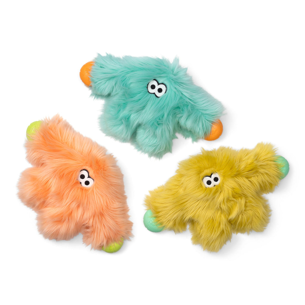 Three shaggy plush dog toys in mint, peach and olive