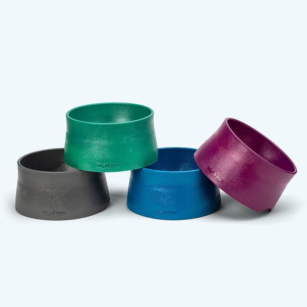 Stacked non-slip dog bowls in charcoal, green, blue and plum