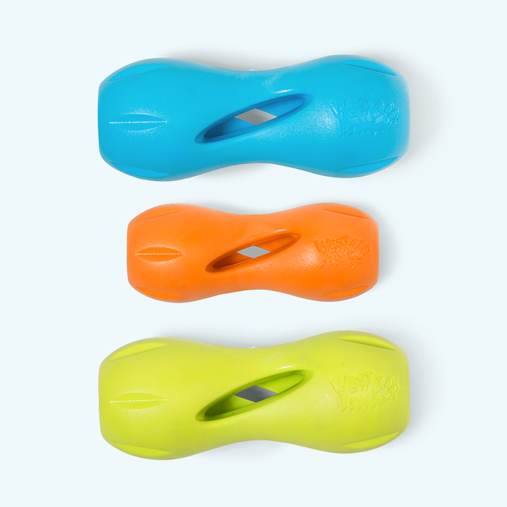 Hourglass-shaped treat toys in blue, orange and lime