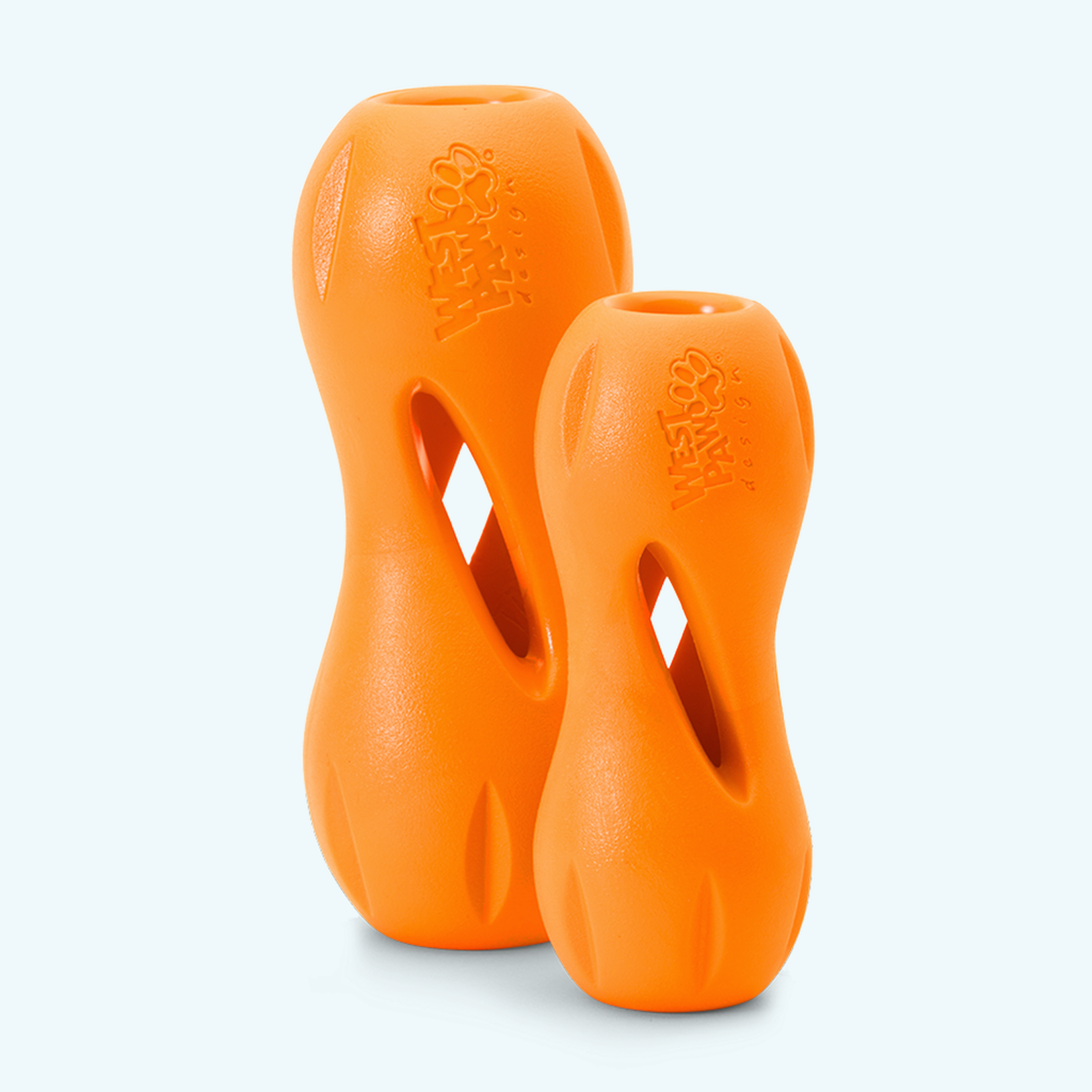 Two orange hourglass treat toys standing upright