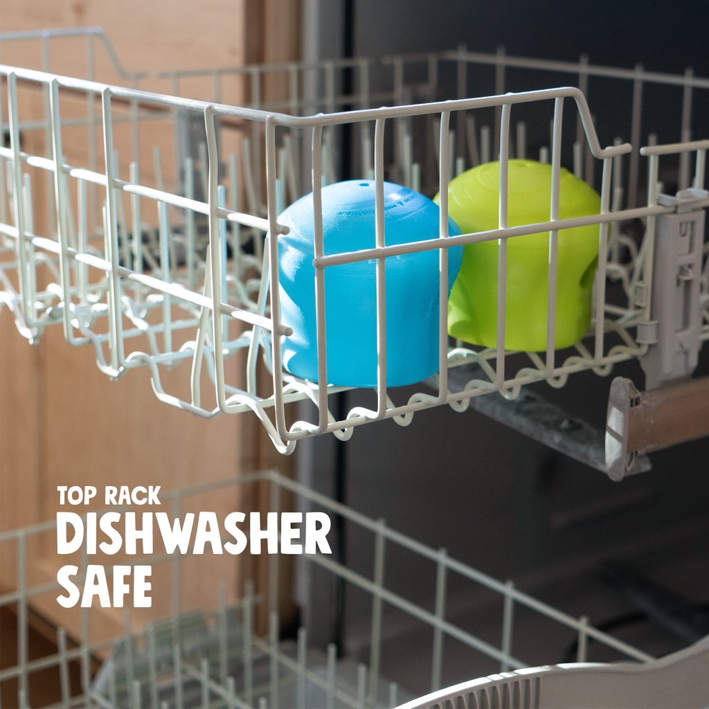 Blue and lime treat toys in the top rack of a dishwasher