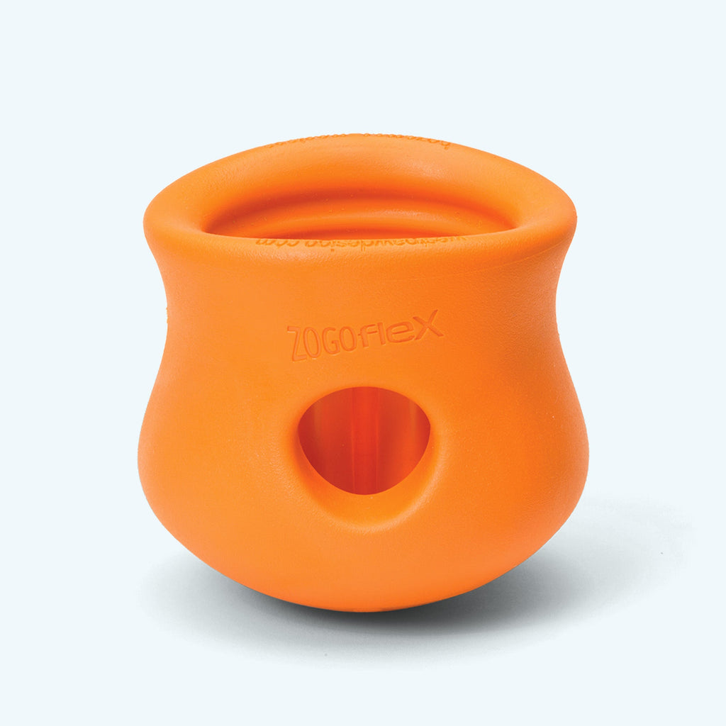 Orange pot-shaped treat toy, side view showing the hole