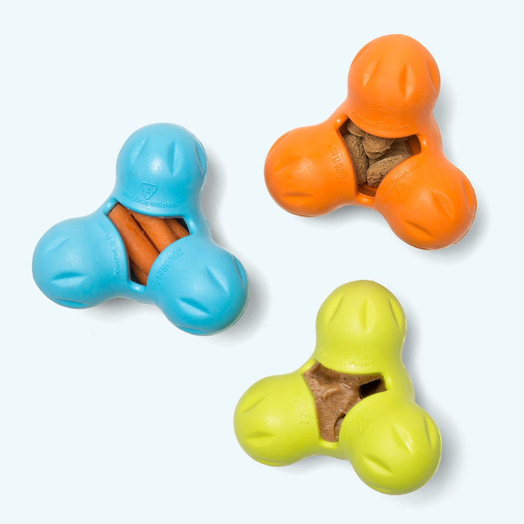 Three-lobed treat toys in blue, orange and lime with treats inside
